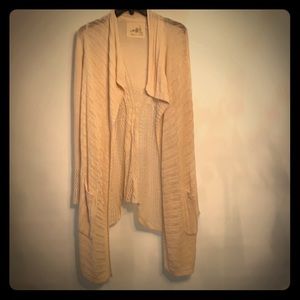 Cream draped knit sweater.  Bought at a boutique.